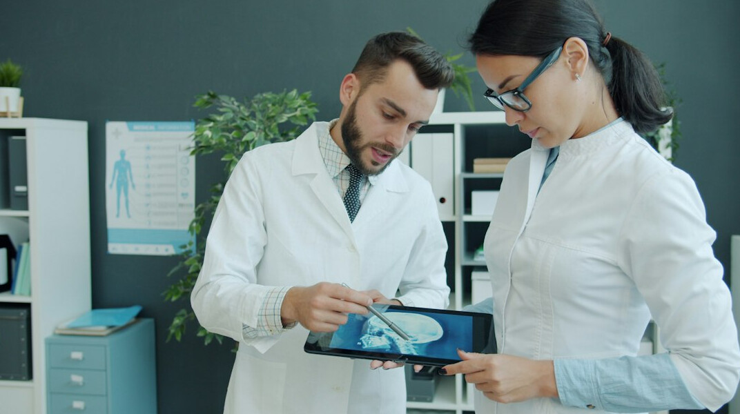 doctor using digital tablet